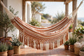 Brazilian cotton double hammock hanging between cedar trees in Nanoose Bay, BC