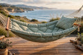 Quilted fabric hammock with pillow hanging on a patio in BC