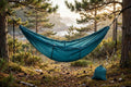 Ultralight single travel hammock packed small beside a backpack on a BC trail