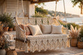 Macramé double swing bench, hand-knotted, hanging on a garden porch in BC