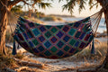 Nicaraguan diamond-weave double hammock, handmade patterned weave, hanging between cedar trees