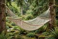 King Mayan hammock in natural ecru cotton weave hanging wide between cedar trees